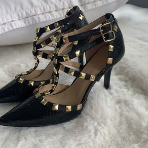 Black leather heels with gold studs
